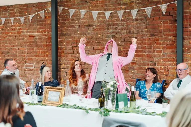 Guests laughing at a toast during the speeches at Norfolk Mead Hotel on Fiona and Tom's wedding day