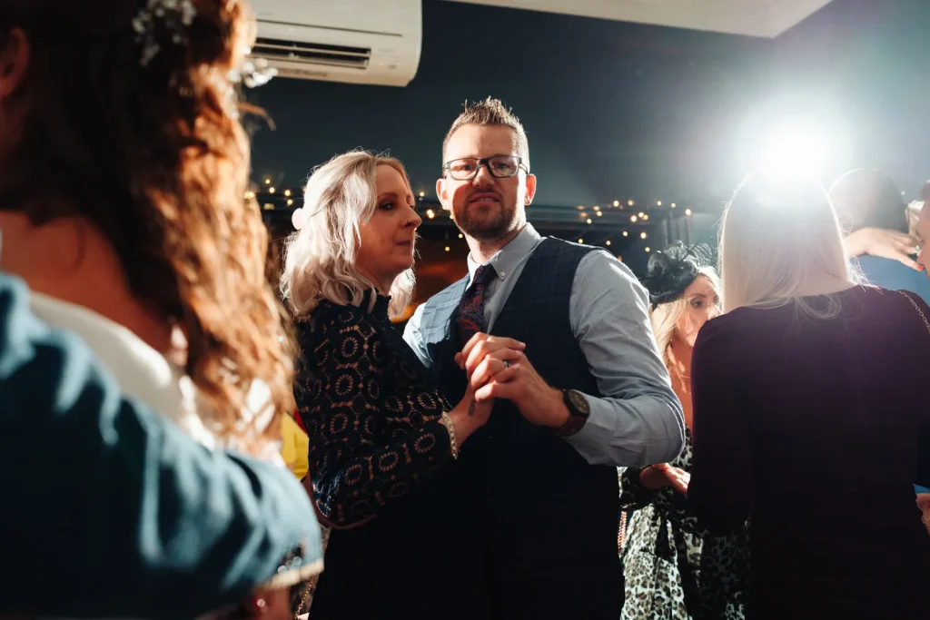 Friends dancing together on the lively dance floor at The Georgian Townhouse Norwich wedding evening reception