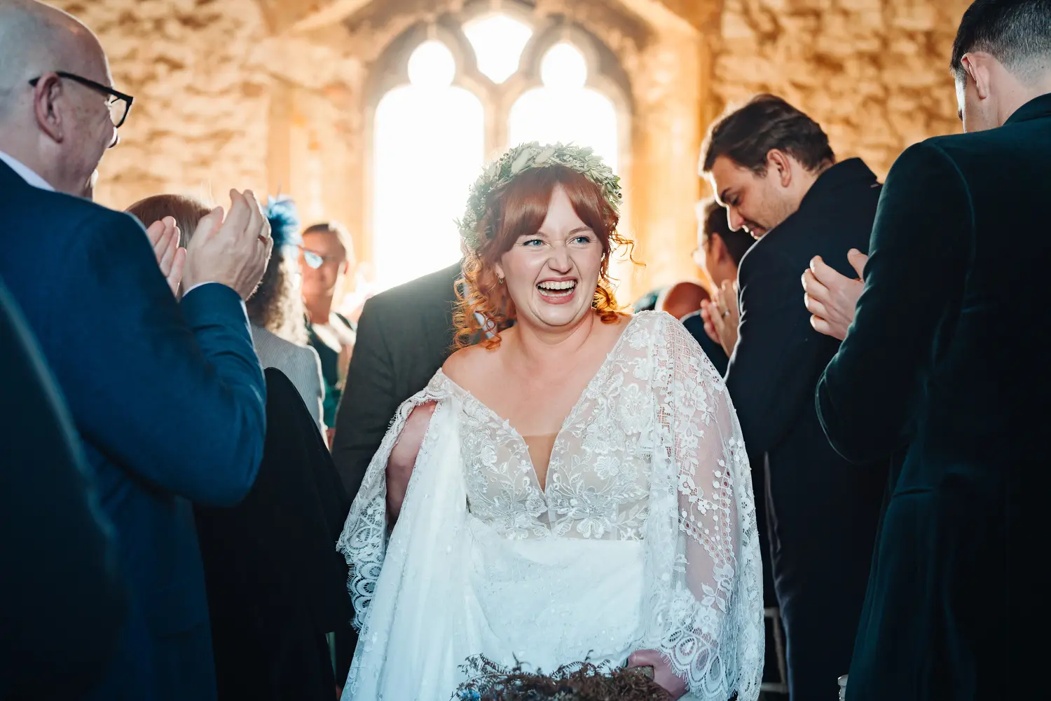 Guests seated in the beautiful Pentney Abbey ceremony room waiting for the service to begin