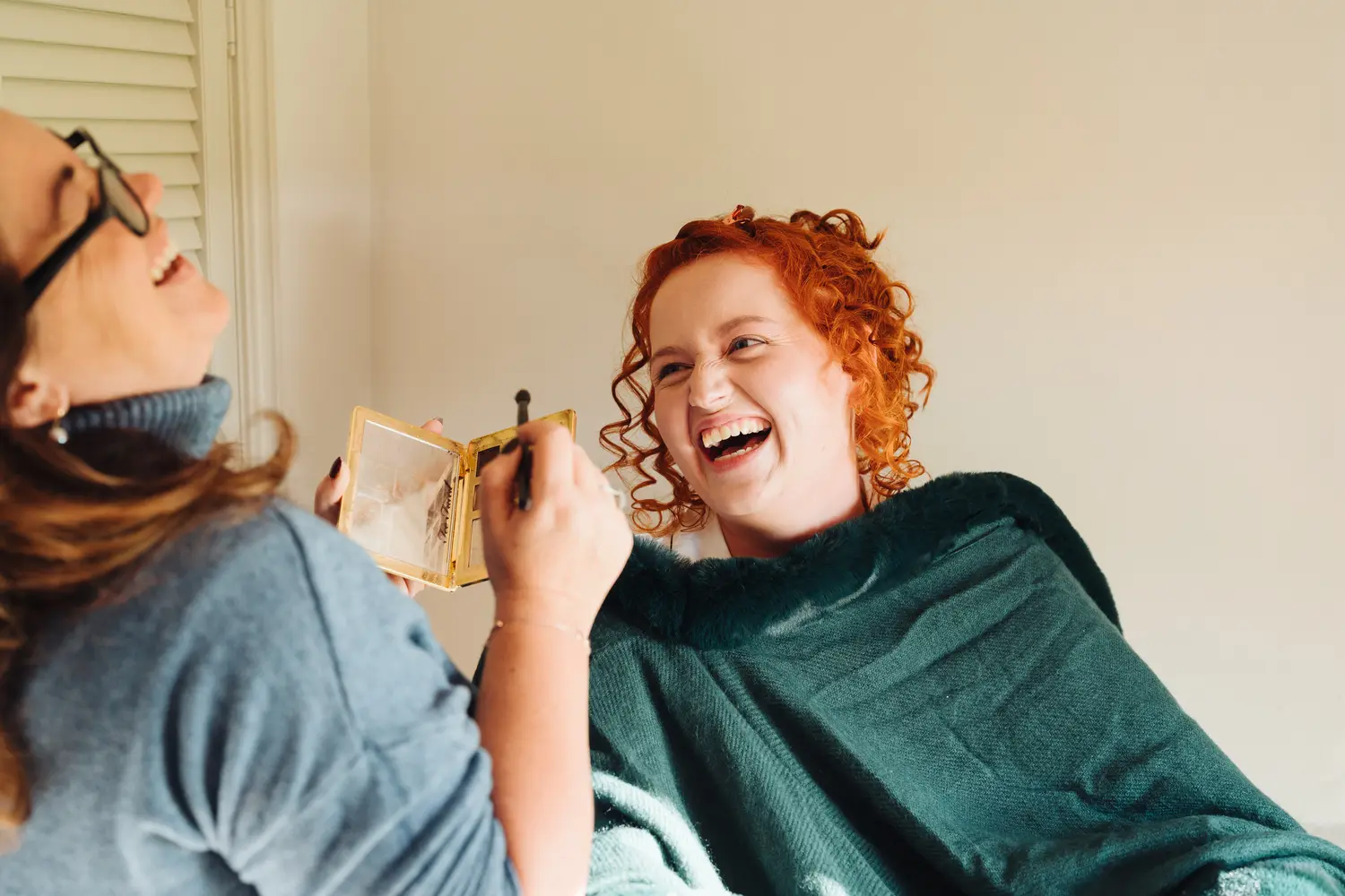 Bridal party getting ready with high spirits ahead of Pentney Abbey wedding ceremony Norfolk