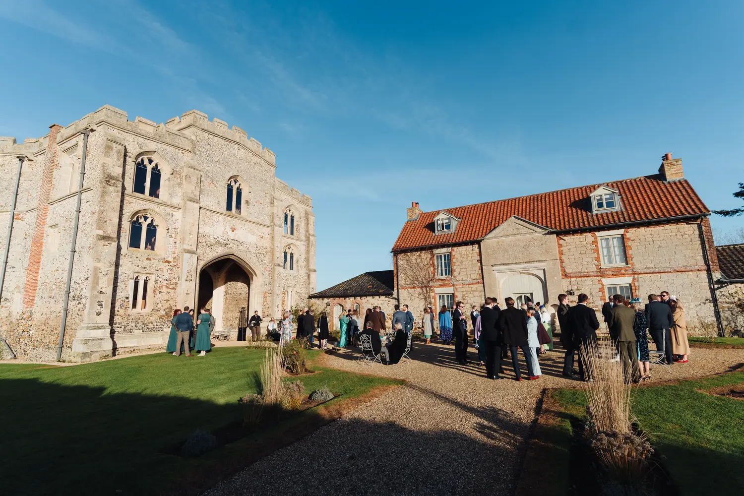 Family group photograph taken outside the stunning Pentney Abbey venue in Norfolk