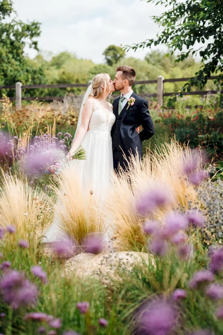 Wedding couple among wild grasses and flowers – half day wedding photography in Norfolk