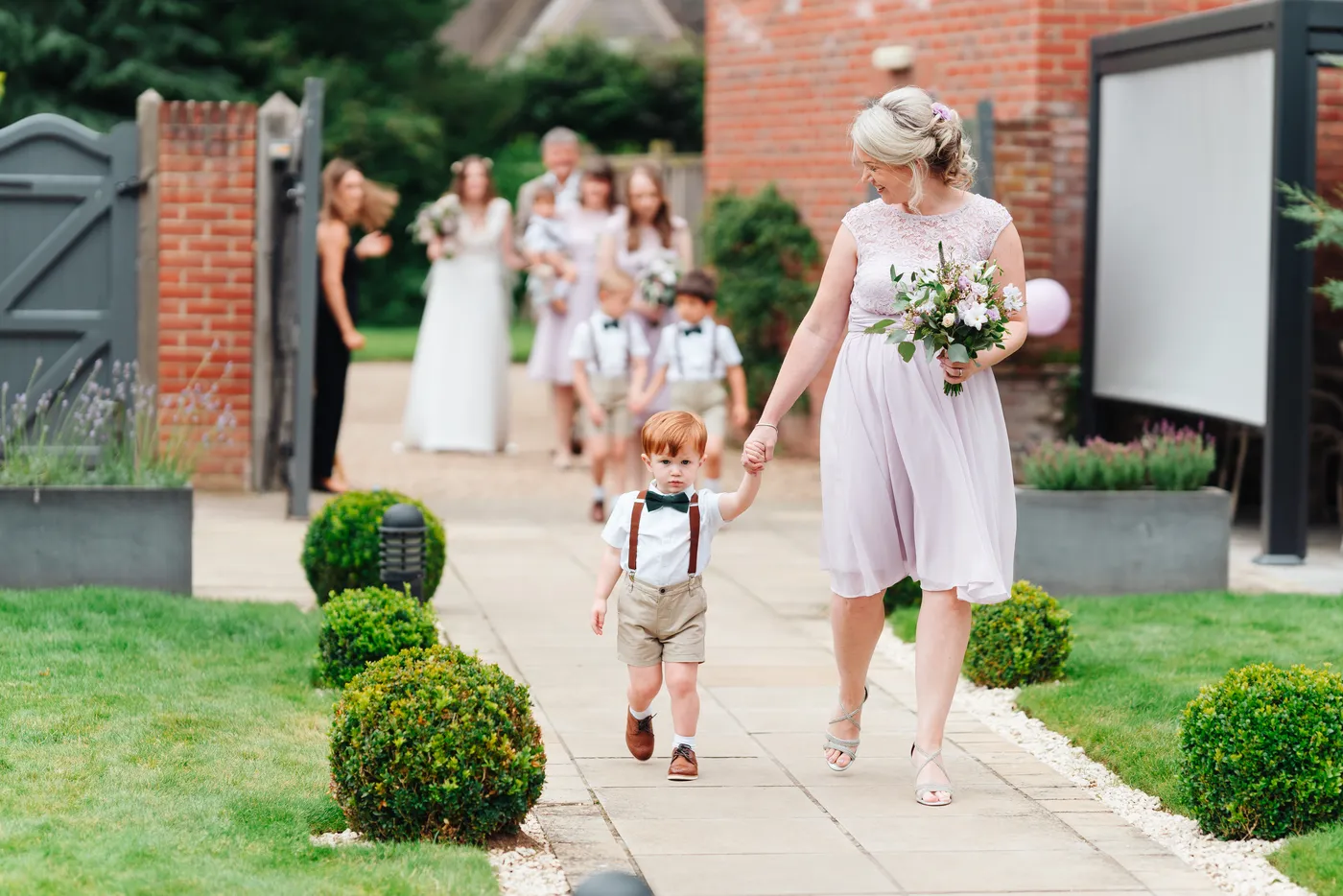 Hannah smiling at Gareth during their wedding ceremony at Norfolk Mead Hotel Norfolk