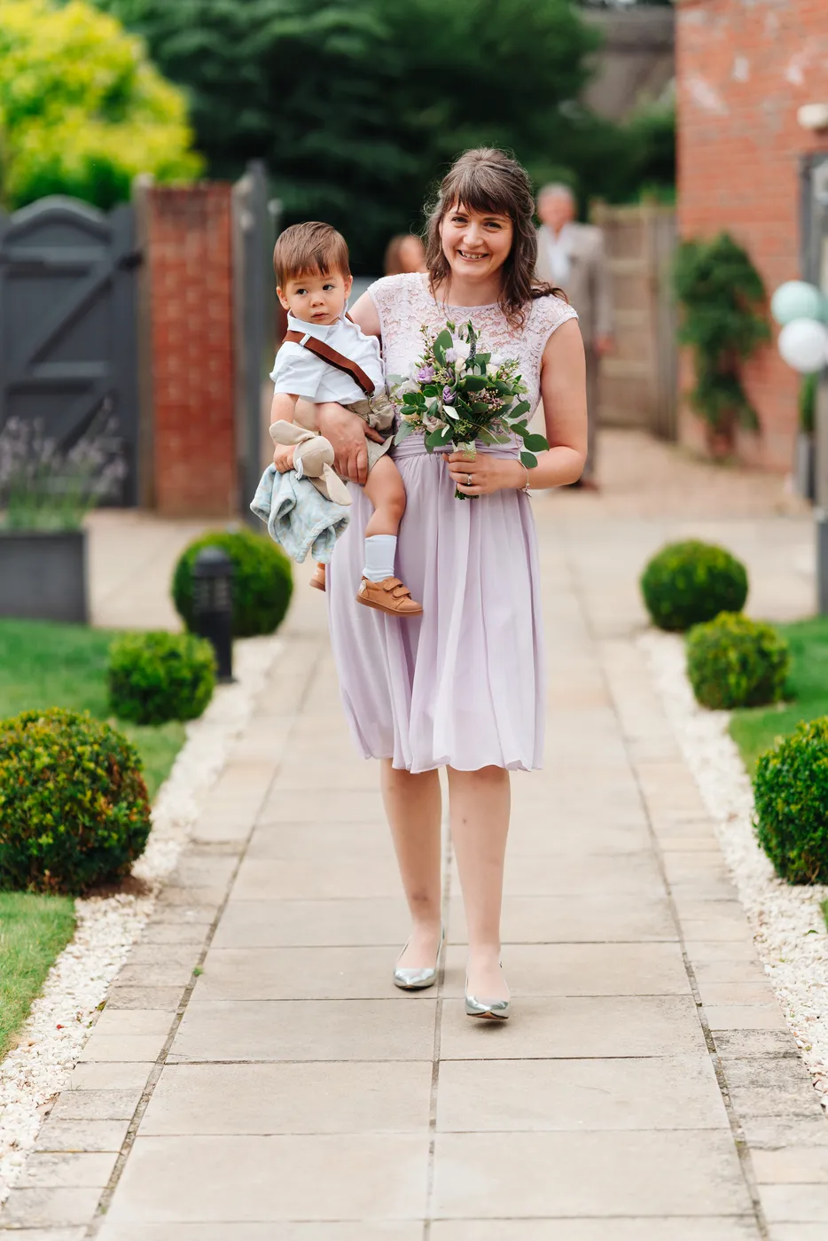 Bride holding her bouquet during the ceremony at The Norfolk Mead Hotel Coltishall