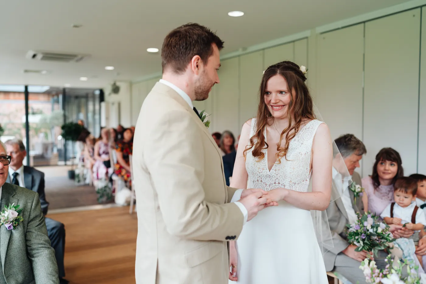 Hannah and Gareth walking through confetti at The Norfolk Mead Hotel Coltishall