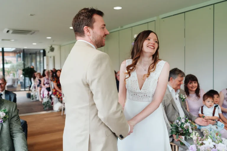 Confetti raining down on the bride and groom at Norfolk Mead Hotel summer wedding
