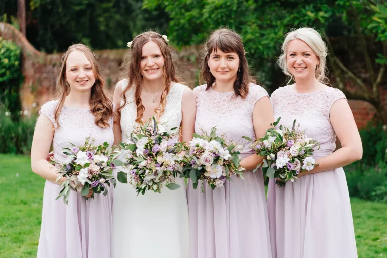 Wedding guests enjoying the walled garden at The Norfolk Mead Hotel summer wedding