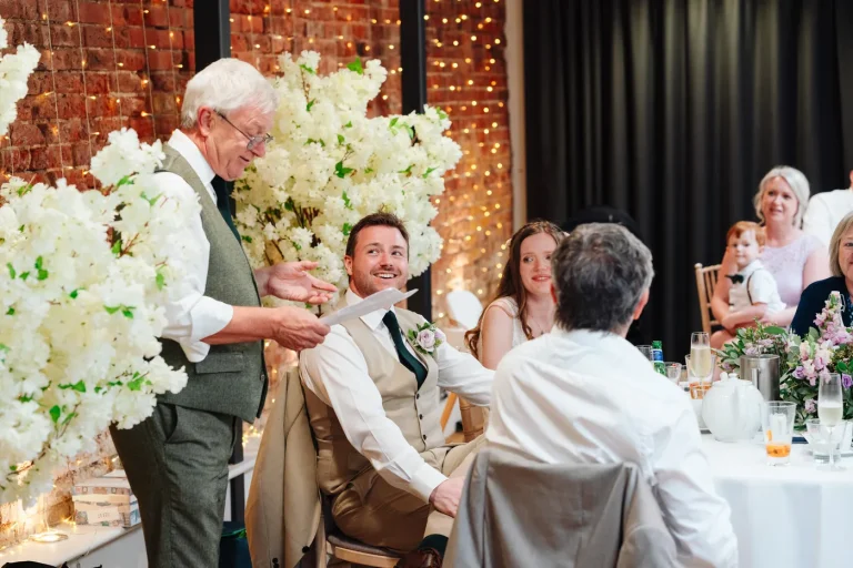Hannah and Gareth laughing together during golden hour at Norfolk Mead Hotel Norfolk
