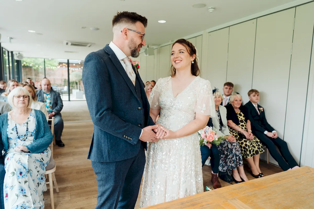 Wedding couple sharing a relaxed moment in the grounds of Norfolk Mead Hotel Coltishall