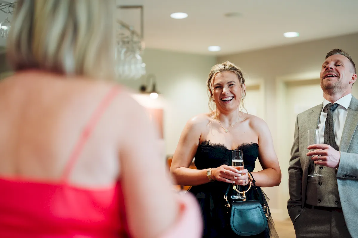 Annalie walking down the aisle in the Garden Room at Norfolk Mead Hotel Coltishall