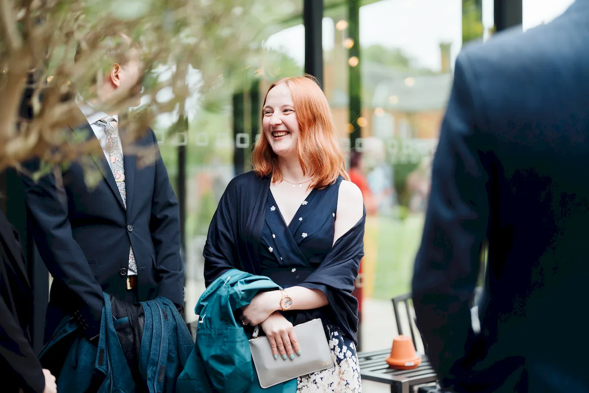 Wedding guests watching the ceremony in the Garden Room at Norfolk Mead Hotel Norfolk