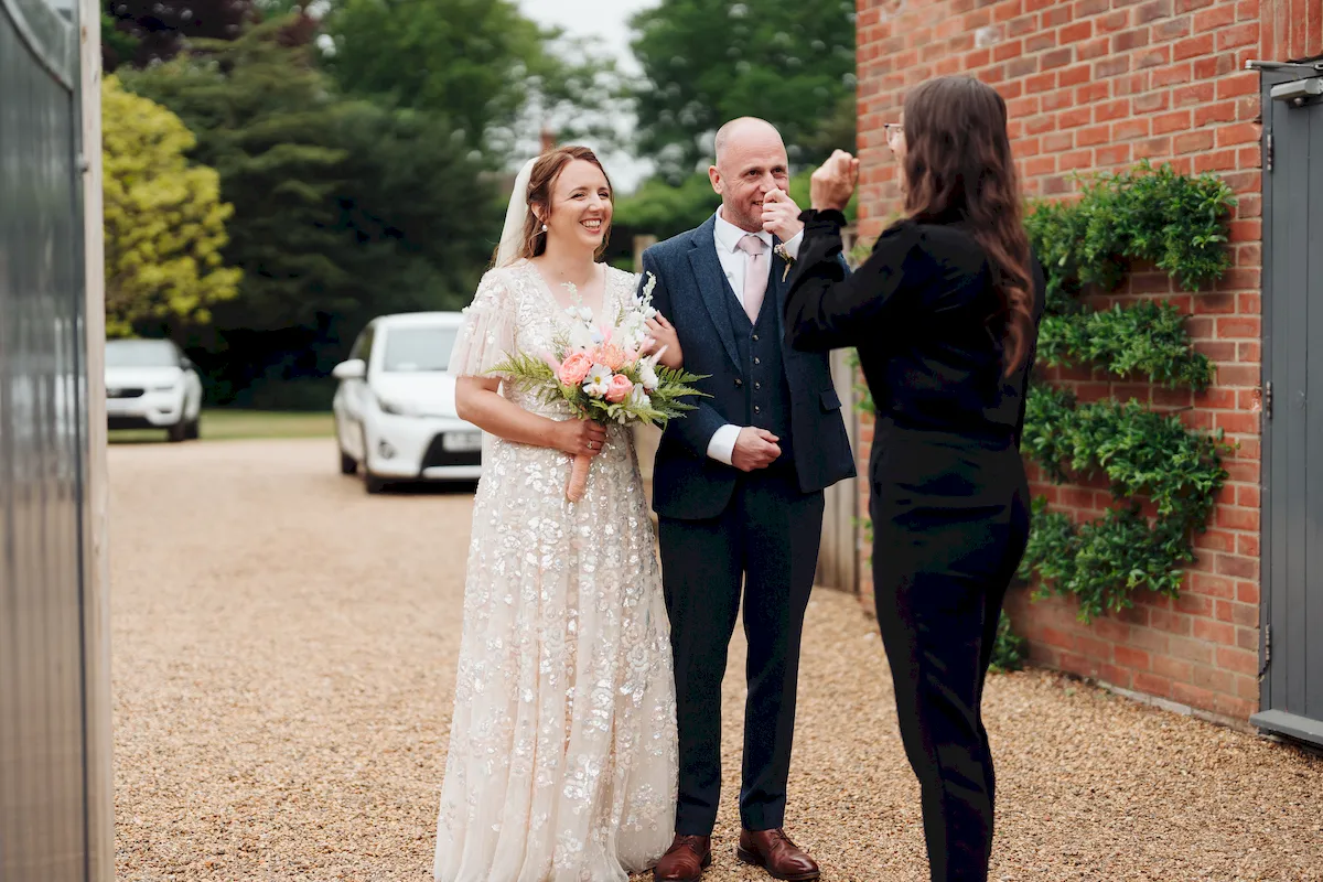 Newlyweds laughing together during the ceremony at The Norfolk Mead Hotel Norfolk