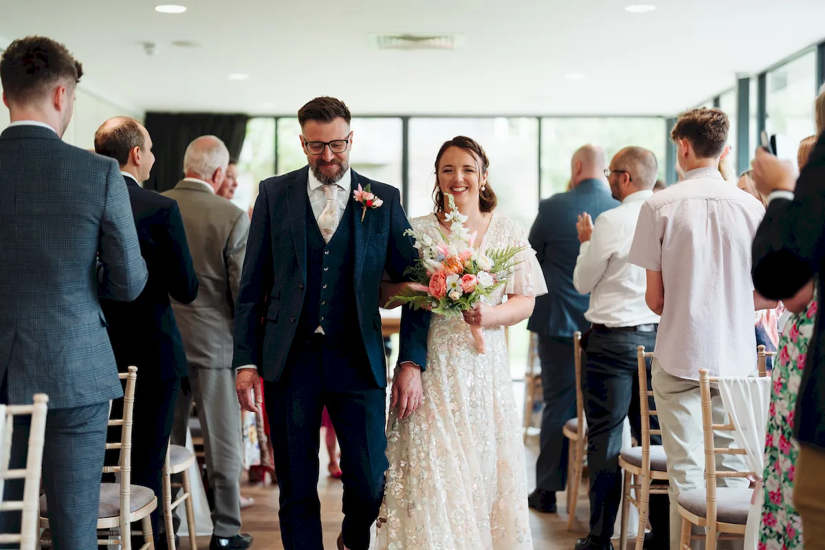 Annalie laughing in a shower of confetti at Norfolk Mead Hotel Coltishall Norfolk