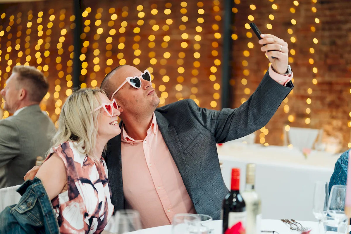 Candid moment between friends at The Norfolk Mead Hotel wedding reception Norfolk