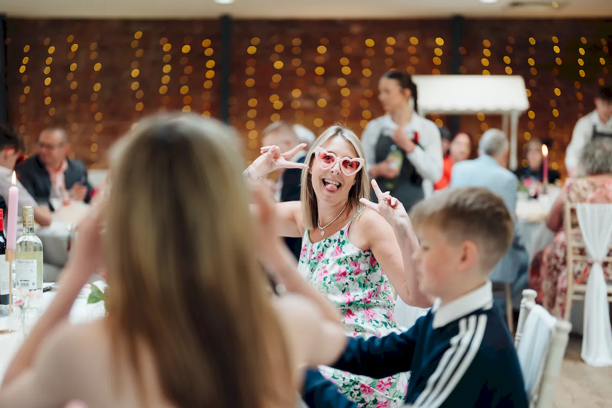 Wedding guests gathered in the walled garden at The Norfolk Mead Hotel Coltishall