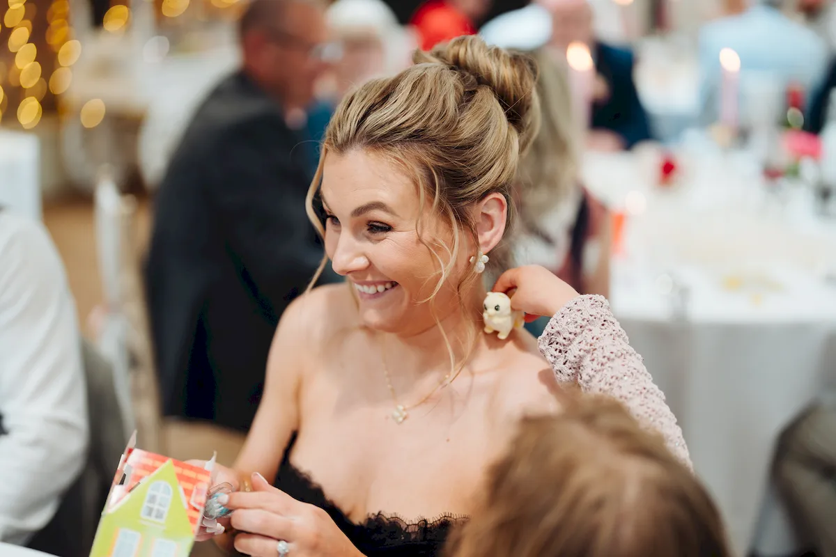 Joyful moment between wedding guests at The Norfolk Mead Hotel Coltishall Norfolk