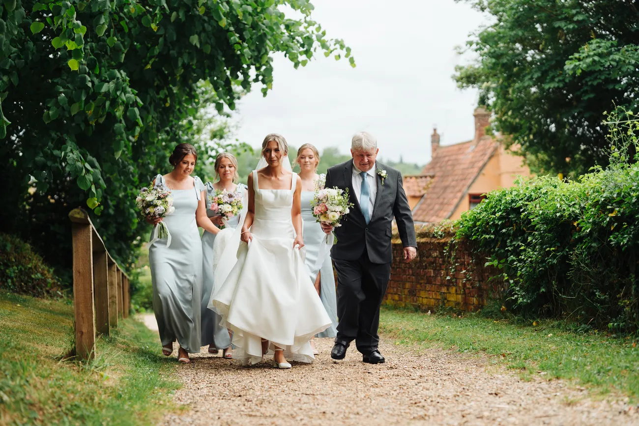 Confetti shower for Lucy and George outside St Andrew's Church Eaton Suffolk