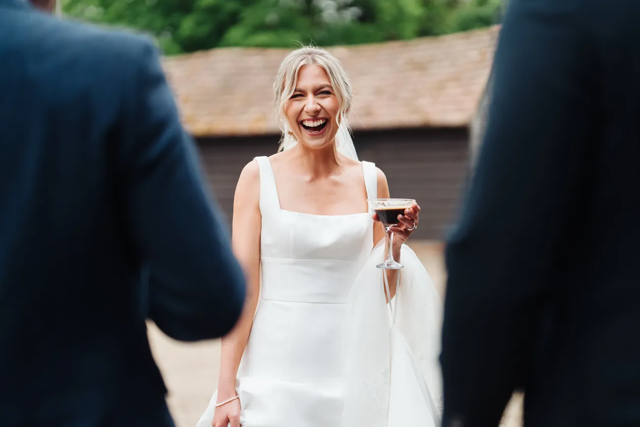 Lucy and George enjoying their drinks reception at Preston Priory Barn Suffolk