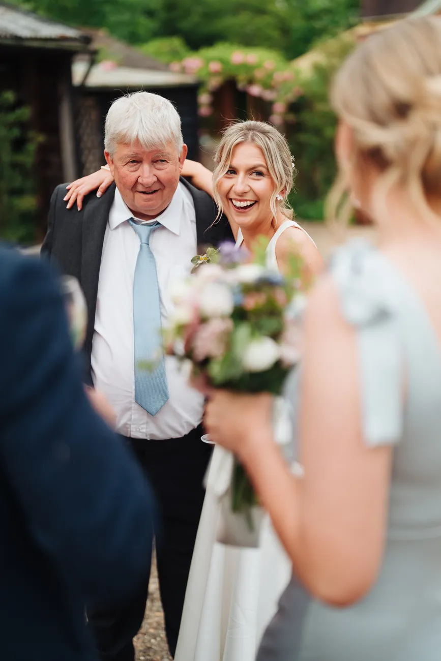 Lucy and George in the beautiful grounds of Preston Priory Barn at dusk