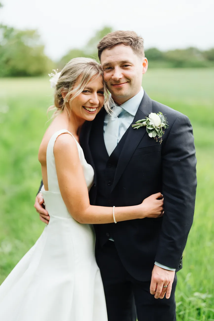 Fun couple portrait at Preston Priory Barn Suffolk wedding