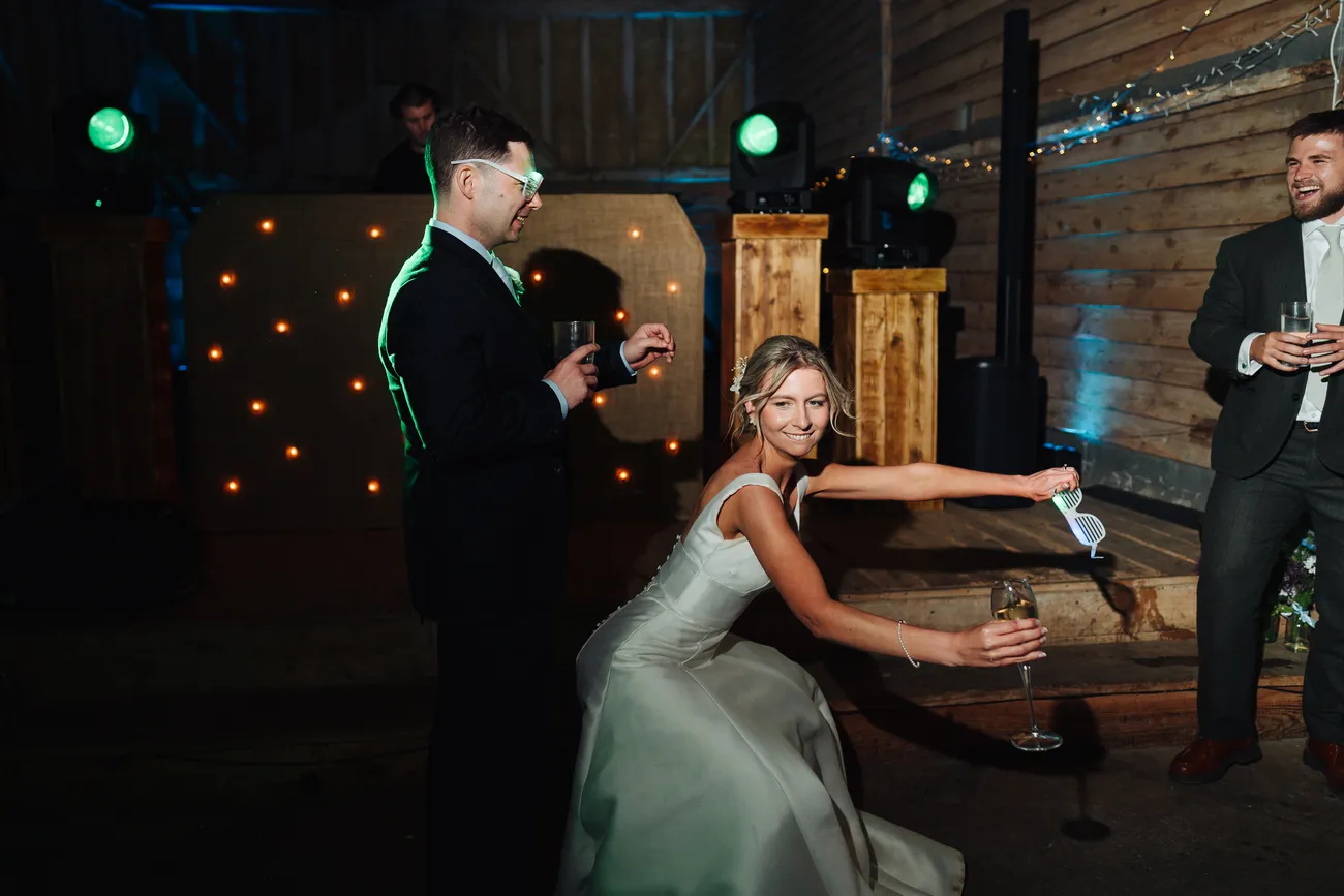 The dancefloor filling up at Lucy and George's wedding at Preston Priory Barn Suffolk