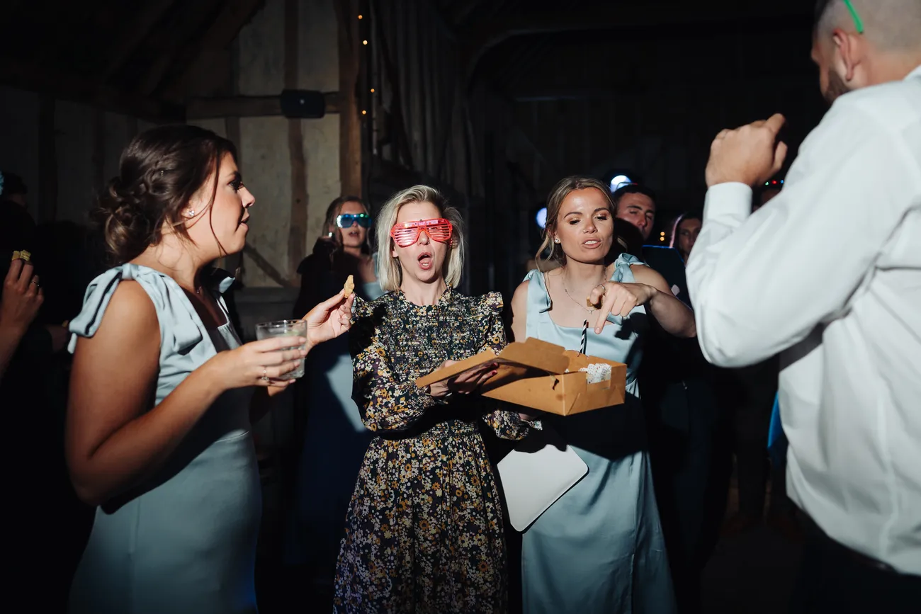 Fun dancefloor moment at Lucy and George's wedding at Preston Priory Barn Suffolk