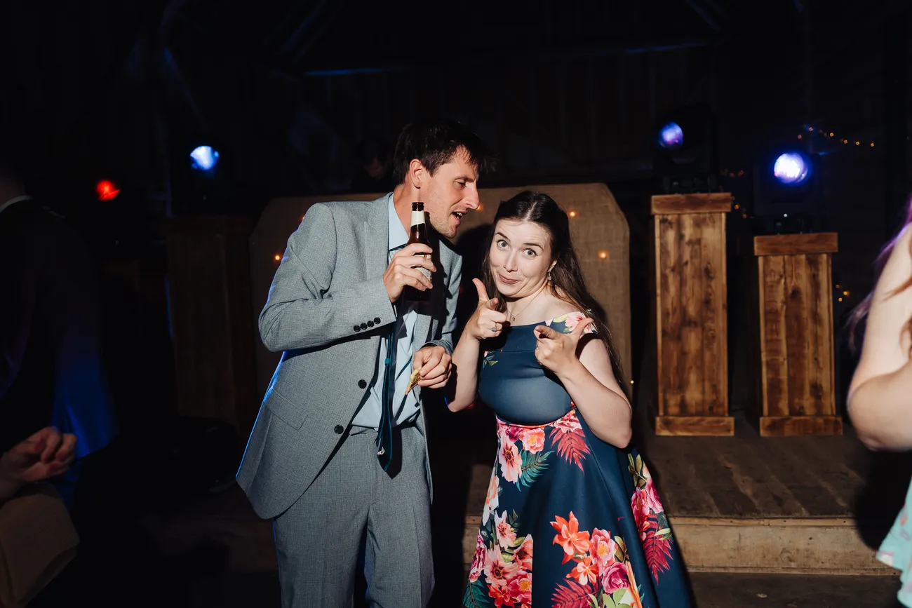 Candid evening reception photo at Preston Priory Barn Suffolk wedding