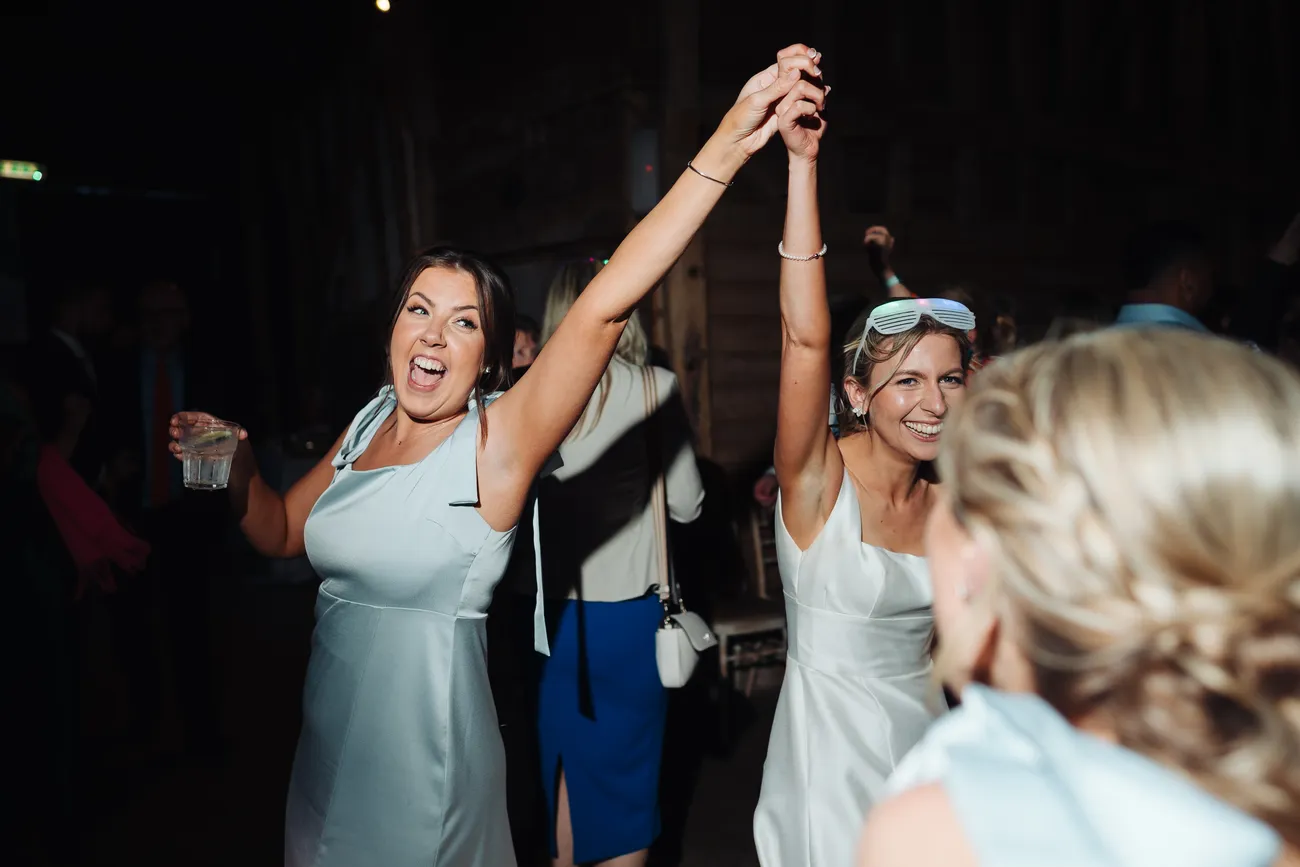 George spinning Lucy on the dancefloor at Preston Priory Barn Suffolk wedding