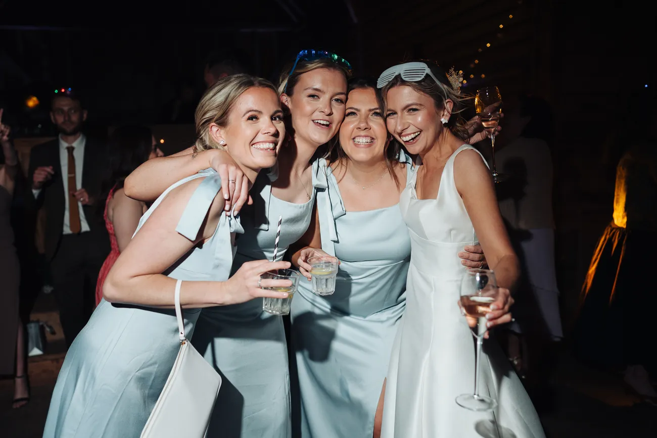 Happy guests celebrating late into the evening at Preston Priory Barn Suffolk
