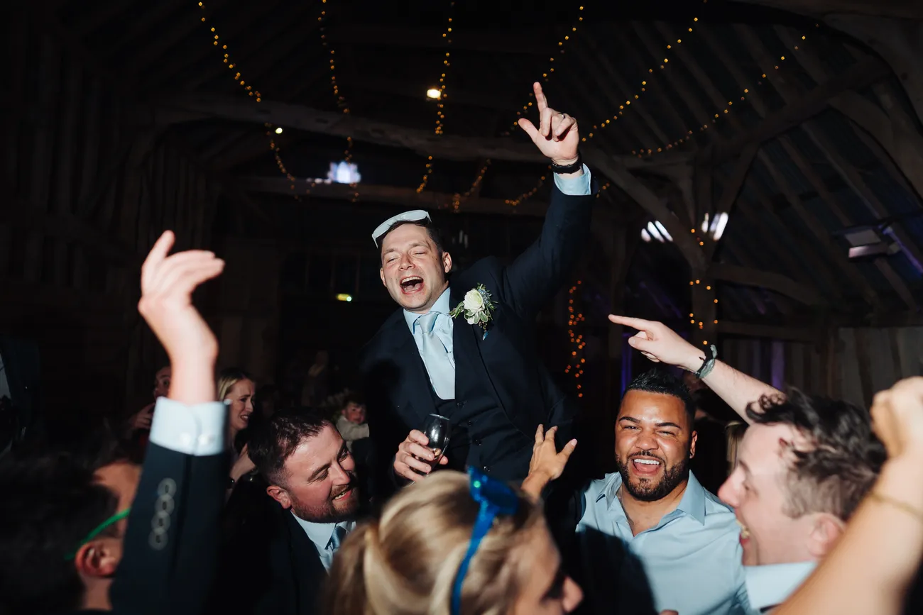 Late evening celebrations at Lucy and George's wedding at Preston Priory Barn
