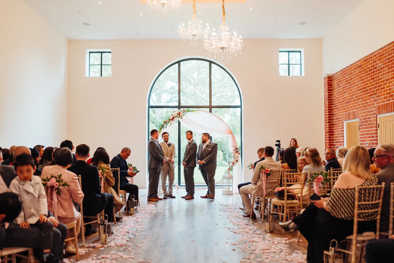 Candid guest reactions during the wedding ceremony at Reymerston Hall